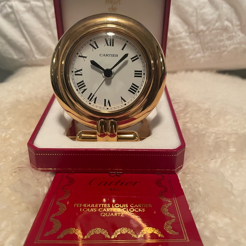 Cartier Colisée travel clock. Authentic. Never used. Saphires on the back.